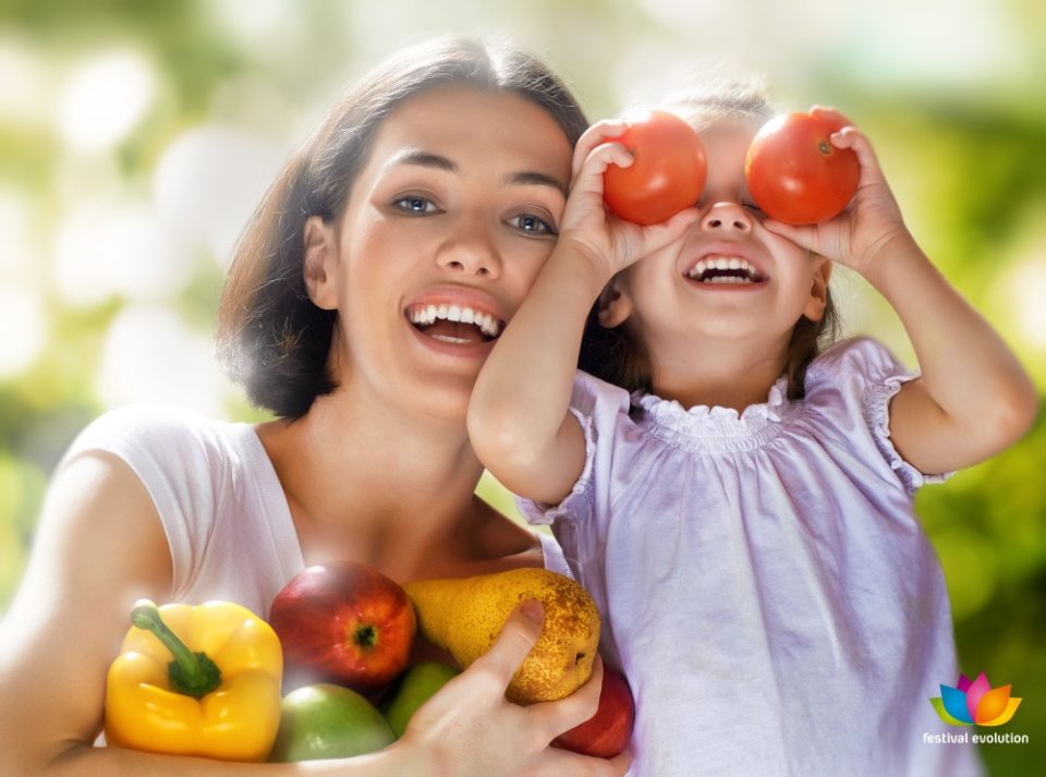 happy family keeps fresh vegetables